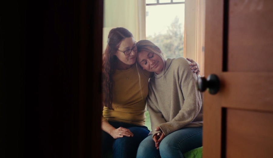 Two people embracing for comfort and support